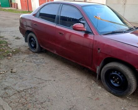 Красный Дэу Нубира, объемом двигателя 1.6 л и пробегом 580 тыс. км за 1100 $, фото 4 на Automoto.ua