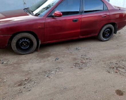 Красный Дэу Нубира, объемом двигателя 1.6 л и пробегом 580 тыс. км за 1100 $, фото 1 на Automoto.ua