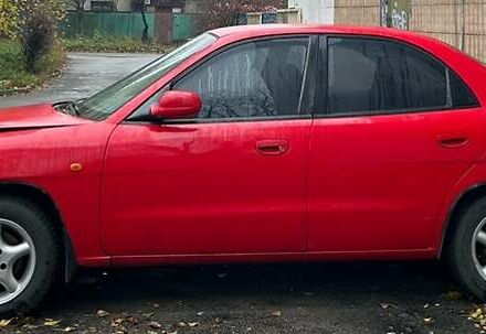 Червоний Деу Нубіра, об'ємом двигуна 1.6 л та пробігом 230 тис. км за 1100 $, фото 3 на Automoto.ua