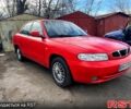Красный Дэу Нубира, объемом двигателя 1.6 л и пробегом 100 тыс. км за 1550 $, фото 2 на Automoto.ua