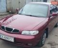 Красный Дэу Нубира, объемом двигателя 1.6 л и пробегом 275 тыс. км за 3700 $, фото 1 на Automoto.ua
