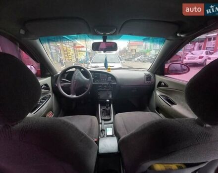 Красный Дэу Нубира, объемом двигателя 2 л и пробегом 350 тыс. км за 1500 $, фото 4 на Automoto.ua