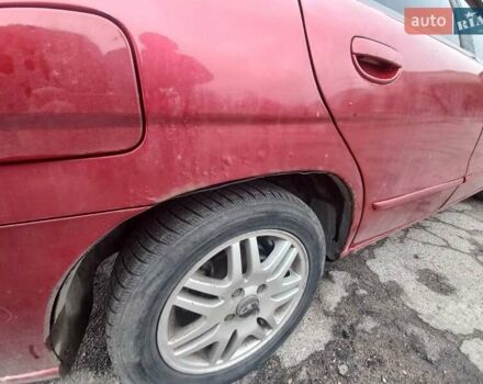 Красный Дэу Нубира, объемом двигателя 2 л и пробегом 350 тыс. км за 1500 $, фото 6 на Automoto.ua