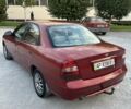 Красный Дэу Нубира, объемом двигателя 2 л и пробегом 302 тыс. км за 1900 $, фото 4 на Automoto.ua