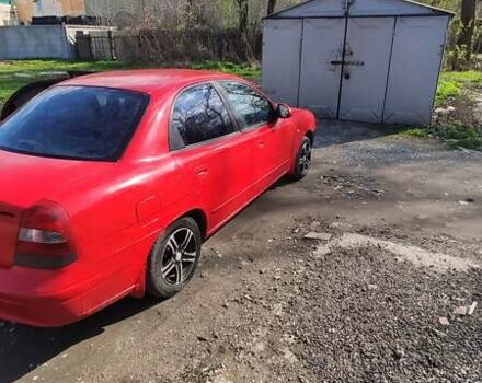 Красный Дэу Нубира, объемом двигателя 2 л и пробегом 300 тыс. км за 1499 $, фото 4 на Automoto.ua