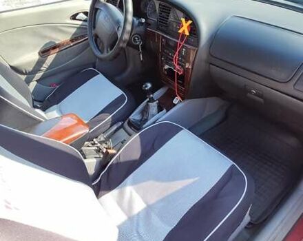 Красный Дэу Нубира, объемом двигателя 2 л и пробегом 300 тыс. км за 1499 $, фото 1 на Automoto.ua