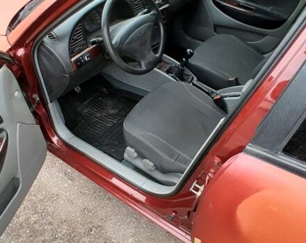 Червоний Деу Нубіра, об'ємом двигуна 2 л та пробігом 321 тис. км за 1600 $, фото 4 на Automoto.ua