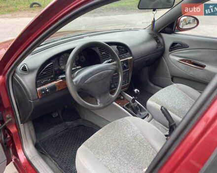 Красный Дэу Нубира, объемом двигателя 2 л и пробегом 150 тыс. км за 2450 $, фото 6 на Automoto.ua