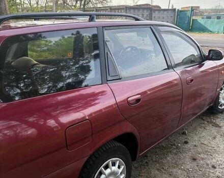 Красный Дэу Нубира, объемом двигателя 1.6 л и пробегом 190 тыс. км за 2350 $, фото 12 на Automoto.ua