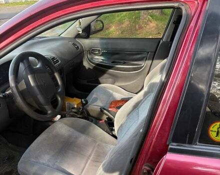 Красный Дэу Нубира, объемом двигателя 1.6 л и пробегом 190 тыс. км за 2350 $, фото 6 на Automoto.ua