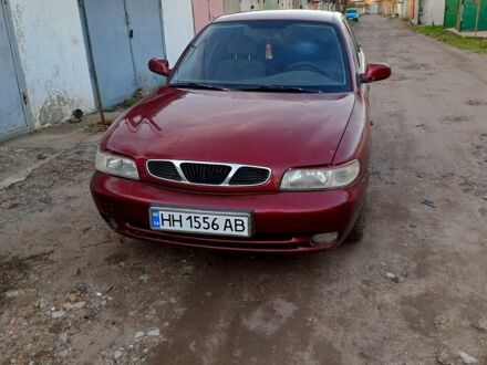 Красный Дэу Нубира, объемом двигателя 1.6 л и пробегом 580 тыс. км за 1100 $, фото 1 на Automoto.ua