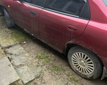 Красный Дэу Нубира, объемом двигателя 1.6 л и пробегом 230 тыс. км за 1400 $, фото 1 на Automoto.ua