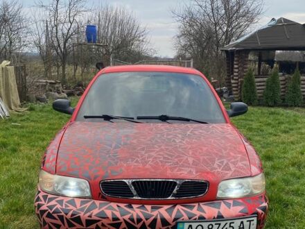 Красный Дэу Нубира, объемом двигателя 1.6 л и пробегом 180 тыс. км за 1050 $, фото 1 на Automoto.ua