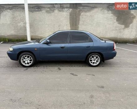 Синий Дэу Нубира, объемом двигателя 1.6 л и пробегом 300 тыс. км за 1294 $, фото 5 на Automoto.ua