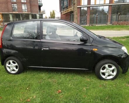 Черный Дайхатсу Куоре, объемом двигателя 1 л и пробегом 122 тыс. км за 3500 $, фото 2 на Automoto.ua