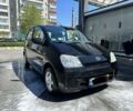 Черный Дайхатсу Куоре, объемом двигателя 0 л и пробегом 124 тыс. км за 3400 $, фото 1 на Automoto.ua