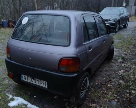 Фиолетовый Дайхатсу Куоре, объемом двигателя 0.85 л и пробегом 155 тыс. км за 2000 $, фото 3 на Automoto.ua