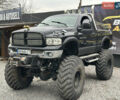 Черный Додж RAM 1500, объемом двигателя 6.87 л и пробегом 150 тыс. км за 14999 $, фото 1 на Automoto.ua