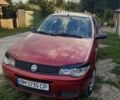 Красный Фиат Альбеа, объемом двигателя 1.37 л и пробегом 245 тыс. км за 3900 $, фото 1 на Automoto.ua