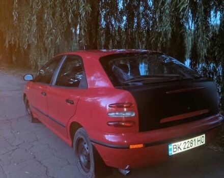 Красный Фиат Брава, объемом двигателя 1.4 л и пробегом 250 тыс. км за 2000 $, фото 1 на Automoto.ua