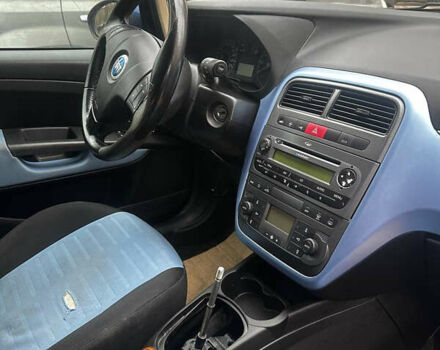 Синий Фиат Гранде Пунто, объемом двигателя 1.4 л и пробегом 152 тыс. км за 2700 $, фото 11 на Automoto.ua