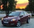 Красный Фиат Линеа, объемом двигателя 1.37 л и пробегом 180 тыс. км за 3200 $, фото 1 на Automoto.ua