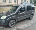Черный Фиат Добло, объемом двигателя 1.4 л и пробегом 370 тыс. км за 4000 $, фото 1 на Automoto.ua