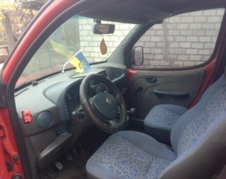 Красный Фиат Добло, объемом двигателя 1 л и пробегом 200 тыс. км за 1894 $, фото 3 на Automoto.ua