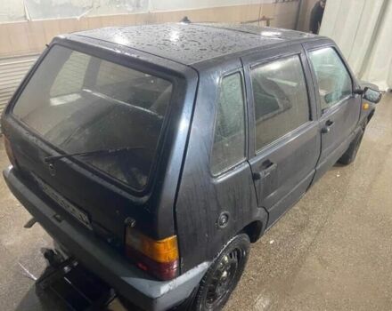 Черный Фиат Уно, объемом двигателя 1.5 л и пробегом 233 тыс. км за 570 $, фото 1 на Automoto.ua