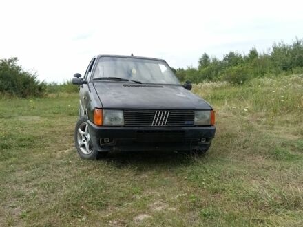 Черный Фиат Уно, объемом двигателя 1.5 л и пробегом 218 тыс. км за 600 $, фото 1 на Automoto.ua