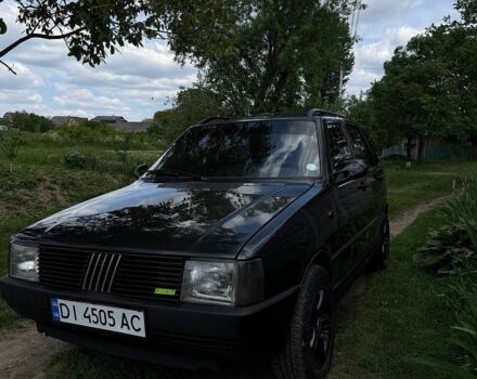Серый Фиат Уно, объемом двигателя 1.1 л и пробегом 249 тыс. км за 1000 $, фото 1 на Automoto.ua
