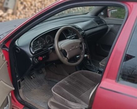 Красный Форд Контур, объемом двигателя 2 л и пробегом 130 тыс. км за 1166 $, фото 1 на Automoto.ua