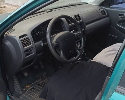 Красный Форд Контур, объемом двигателя 2 л и пробегом 130 тыс. км за 1166 $, фото 7 на Automoto.ua