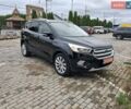 Черный Форд Эскейп, объемом двигателя 2 л и пробегом 200 тыс. км за 12700 $, фото 1 на Automoto.ua