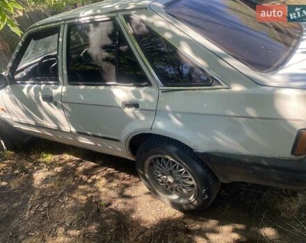 Белый Форд Эскорт, объемом двигателя 1.8 л и пробегом 370 тыс. км за 500 $, фото 1 на Automoto.ua