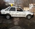 Белый Форд Эскорт, объемом двигателя 1.4 л и пробегом 400 тыс. км за 591 $, фото 1 на Automoto.ua