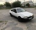 Белый Форд Эскорт, объемом двигателя 1.4 л и пробегом 200 тыс. км за 631 $, фото 1 на Automoto.ua