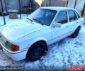 Белый Форд Эскорт, объемом двигателя 1.4 л и пробегом 300 тыс. км за 400 $, фото 1 на Automoto.ua