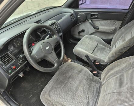 Белый Форд Эскорт, объемом двигателя 1.3 л и пробегом 250 тыс. км за 750 $, фото 5 на Automoto.ua