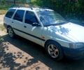 Белый Форд Эскорт, объемом двигателя 1.4 л и пробегом 200 тыс. км за 1300 $, фото 1 на Automoto.ua