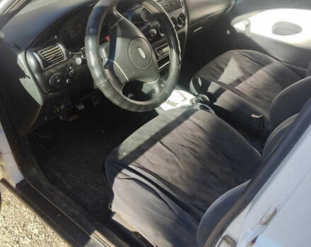 Белый Форд Эскорт, объемом двигателя 1.3 л и пробегом 300 тыс. км за 900 $, фото 2 на Automoto.ua