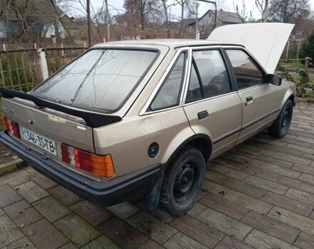 Бежевый Форд Эскорт, объемом двигателя 1.4 л и пробегом 189 тыс. км за 500 $, фото 1 на Automoto.ua