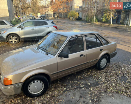 Бежевий Форд Ескорт, об'ємом двигуна 1.4 л та пробігом 150 тис. км за 880 $, фото 1 на Automoto.ua