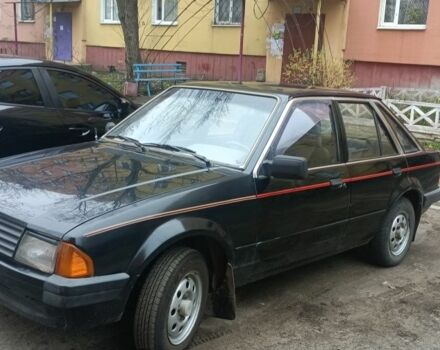 Черный Форд Эскорт, объемом двигателя 1.3 л и пробегом 200 тыс. км за 593 $, фото 1 на Automoto.ua