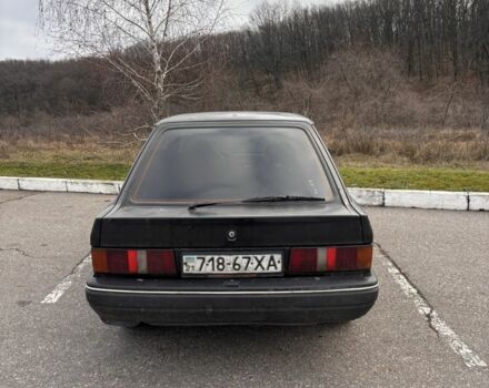 Черный Форд Эскорт, объемом двигателя 1.3 л и пробегом 300 тыс. км за 1000 $, фото 1 на Automoto.ua