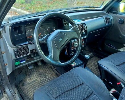 Черный Форд Эскорт, объемом двигателя 1.6 л и пробегом 230 тыс. км за 500 $, фото 1 на Automoto.ua