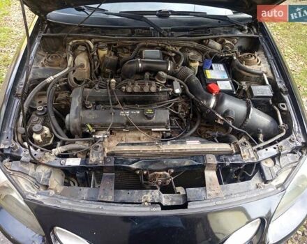 Черный Форд Эскорт, объемом двигателя 2 л и пробегом 147 тыс. км за 2000 $, фото 11 на Automoto.ua