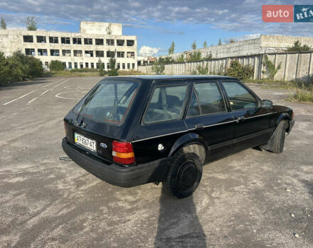 Черный Форд Эскорт, объемом двигателя 1.4 л и пробегом 330 тыс. км за 750 $, фото 4 на Automoto.ua