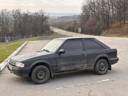 Черный Форд Эскорт, объемом двигателя 1.3 л и пробегом 300 тыс. км за 1000 $, фото 1 на Automoto.ua