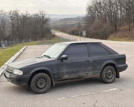 Черный Форд Эскорт, объемом двигателя 1.3 л и пробегом 300 тыс. км за 1000 $, фото 1 на Automoto.ua